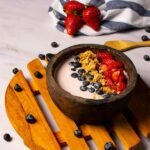strawberries and black berries in brown bowl
